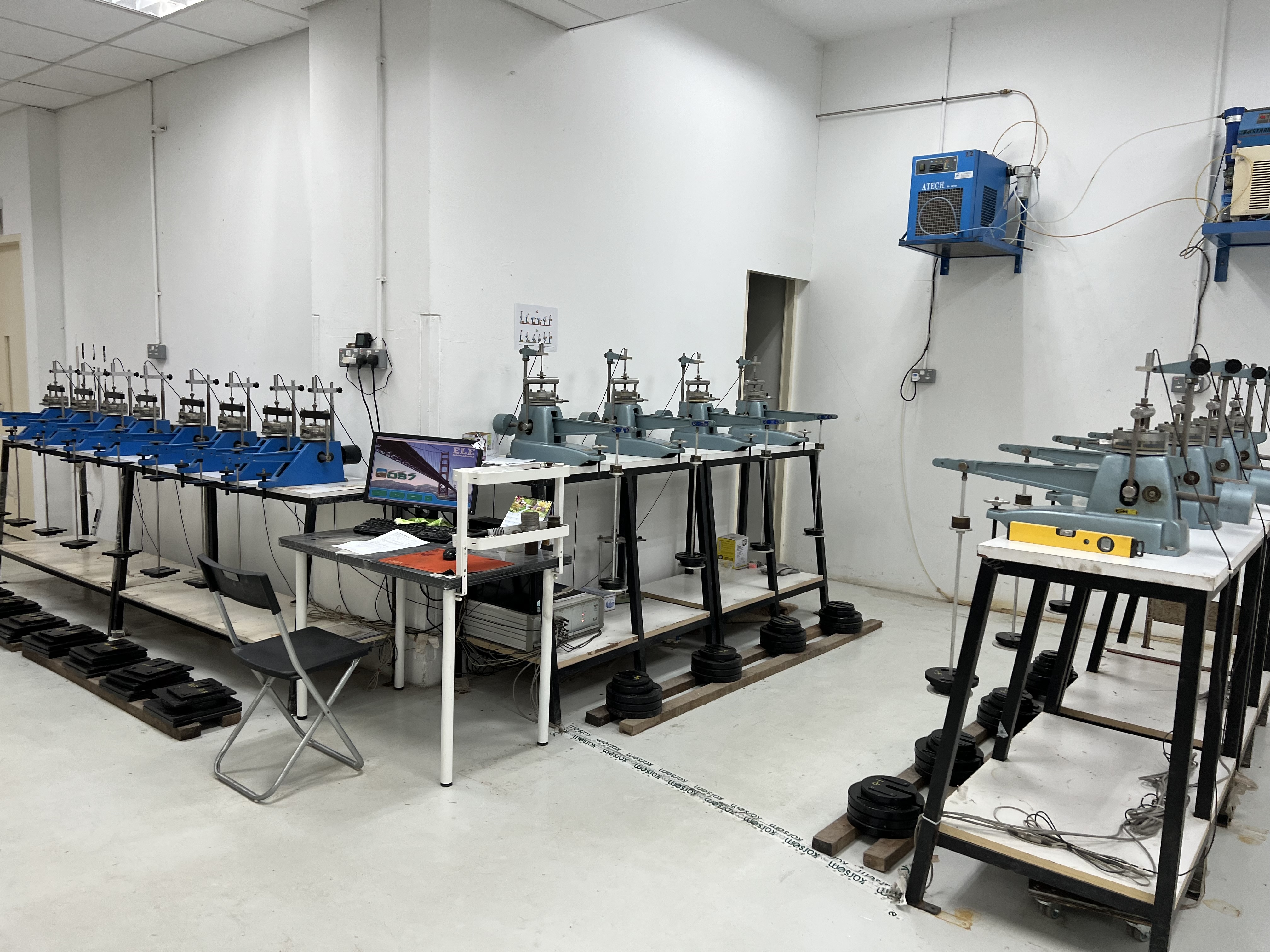 Lab Services consolidation testing laboratory with multiple oedometer frames